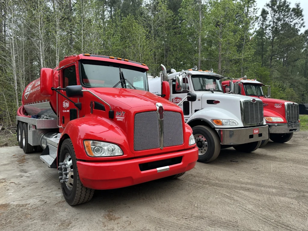 Gray Septic Solutions fleet of septic service trucks